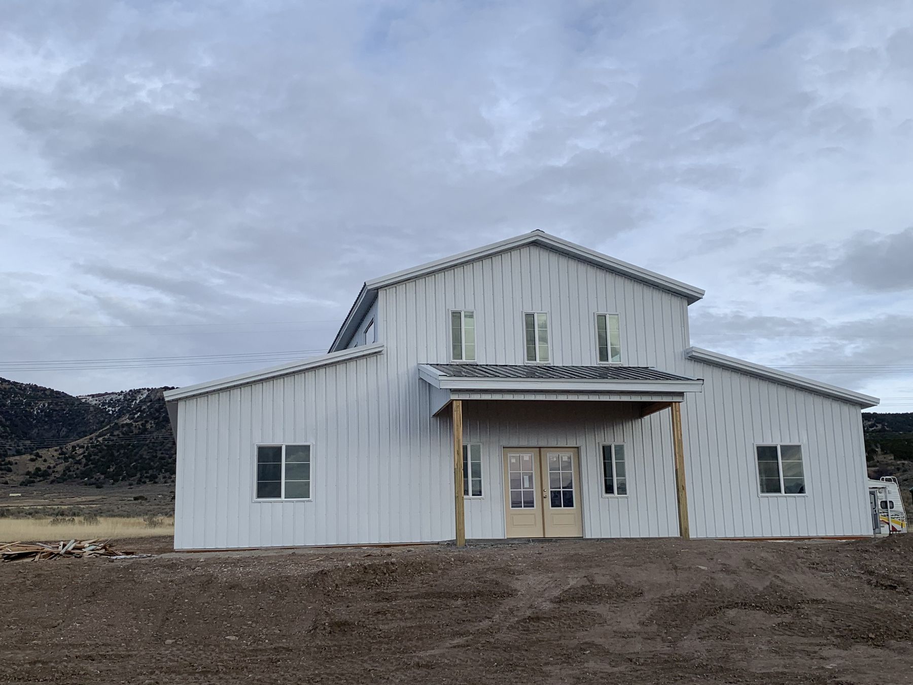 Example barndominium exterior with metal siding and covered entry, illustrating the style and quality of construction